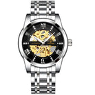 Tevise men's automatic watch with gold accents featuring a sleek skeleton design, silver stainless steel band, and elegant black dial