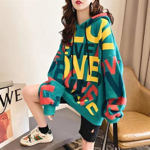 Vibrant Korean style stitching button blouse with a drawstring hood, featuring colorful graphic prints and a relaxed fit