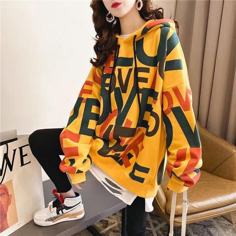 Korean style yellow stitching button blouse with oversized hood, featuring bold colorful lettering and drawstring design for a trendy look