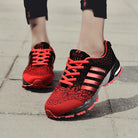 Men's lightweight breathable casual shoes in vibrant red and black, featuring a stylish mesh design for optimal comfort.