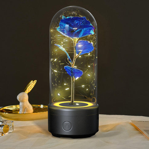 Bluetooth rose flowers LED light in a glass dome, featuring a blue rose illuminated by warm fairy lights, elegant design for home decor