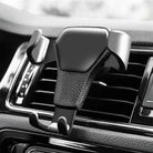 Universal gravity phone mount for car air vent, featuring a sleek design and secure grip for smartphones and GPS devices