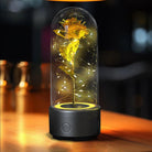 Creative 2 in 1 Bluetooth rose flowers LED light encased in glass, illuminating a beautifully crafted gold rose with twinkling lights