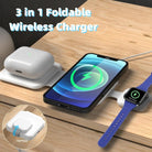 3 in 1 wireless charger with a foldable design on a wooden surface, charging a smartphone, AirPods, and smartwatch