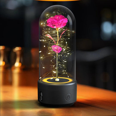 Bluetooth rose flowers LED light with glowing petals and swirling lights in a glass dome, perfect for home decor