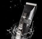 LCD display USB electric clippers surrounded by splashing water, showcasing a sleek design and user-friendly controls