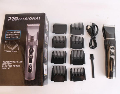 LCD display USB electric clippers with detachable guards, charging cable, and cleaning brush for precise grooming