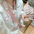 Cozy girl in cat embroidery sports suit with fleece coat and trousers, accessorized with cute pink lanyard