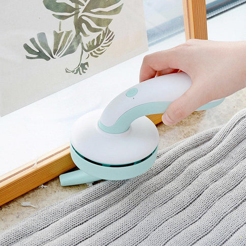 USB desktop vacuum for home in mint green design, ideal for cleaning small spaces and desktops efficiently