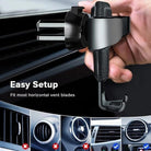 Universal gravity phone mount securely attaches to car air vent, designed for easy setup and compatibility with most vent blades