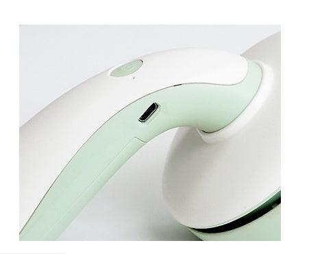 Close-up of a USB portable handheld desktop vacuum cleaner in green, designed for easy cleaning at home.