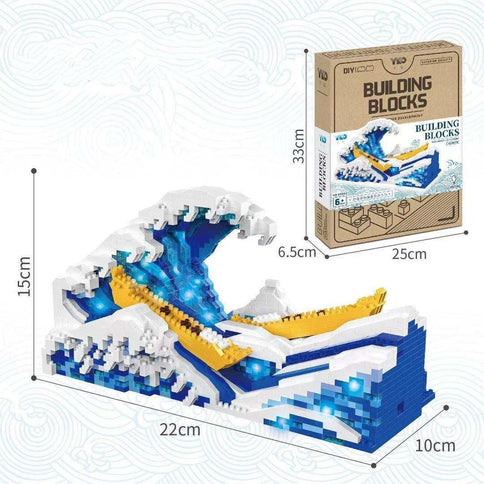 Micro-particle assembling creative building blocks toy depicting a detailed wave design, complete with blue lights and a box showing dimensions