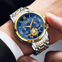 Stylish luminous multifunctional men's watch featuring a moon phase display and a two-tone silver and gold bracelet.