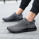 Lightweight large size men's stylish comfortable running shoes featuring a breathable knit design and flexible sole for all-day comfort.