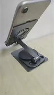 Adjustable phone holder stand allowing 360 degrees rotation, perfect for viewing and stability on desks